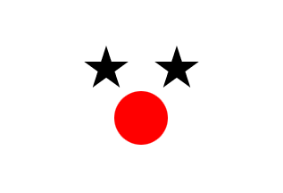white field, red circle centered below 2 black stars
